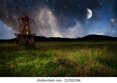 Windmill in the night. Elements of this image furnished by NASA. - Powered by Shutterstock - Get 15% off with code: PIKWIZARD15