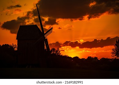 windmill on the background of the setting sun