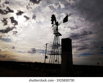 Windmill On A Farm After Sunset