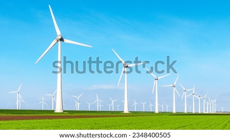 Windmill park with clouds and a blue sky, windmill park in the ocean aerial view with wind turbine Flevoland Netherlands Ijsselmeer. Green Energy production in the Netherlands