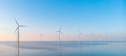 Windmill Park In The Ocean, Drone Aerial View Of Windmill Turbines Generating Green Energy Electric, Windmills Isolated At Sea In The Netherlands. High Quality 4k Footage