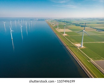 Windmill park offshore and onshore in the Netherlands, huge windmill farm at the Noordoostpolder Flevoland
