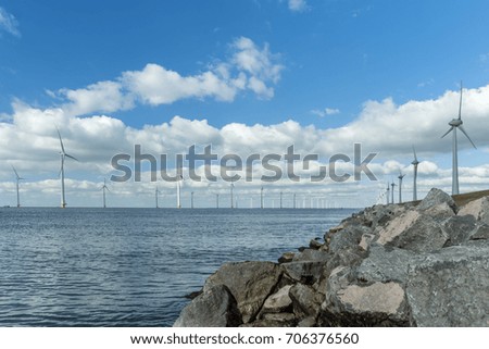 Windmill park Westermeerwind the largest wind farm offshore and on land in theNetherlands.The wind farm produce 1.4 TWh of electricity, enough electricity to over 400,000 households.Urk,Netherlands
