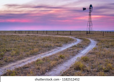 windmill with a pump in shortgrass prairie, Pawnee National Grassland in Colorado near Grover - Shutterstock ID 1182512452