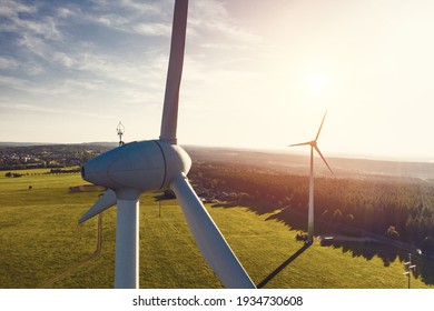 Windmill in a rural area during sunset