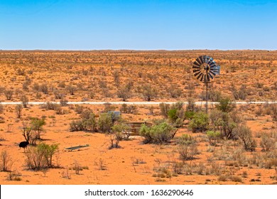 Windmill and solar pump at waterhole in Kalahari Desert, Northern Cape, South Africa - Powered by Shutterstock