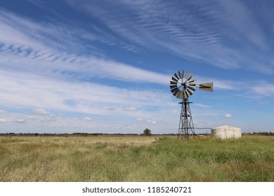 Windmill And Water Tank In Australian Grassland 