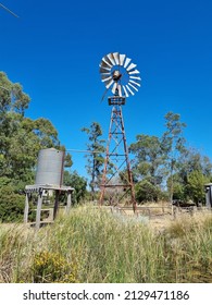 Windmill and water tank in regional Northern Victoria, Australia.