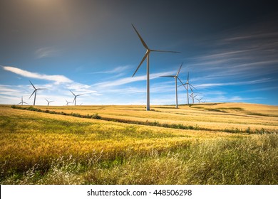 Windmills for electric power production - Powered by Shutterstock