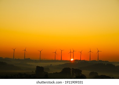 windmills for electricity generation at sunrise in Germany