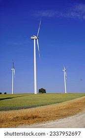 windmills in the fields against the sky
