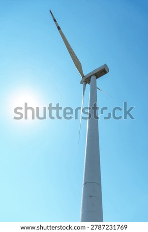 Windmills for generating clean energy. Converting wind energy into electricity.