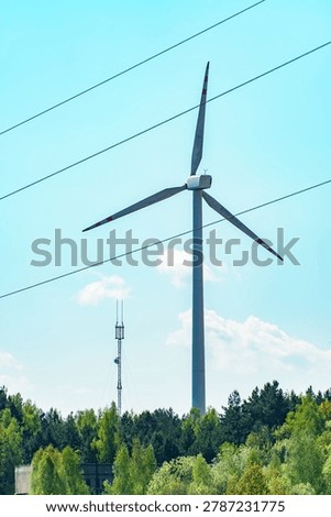 Windmills for generating clean energy. Converting wind energy into electricity.