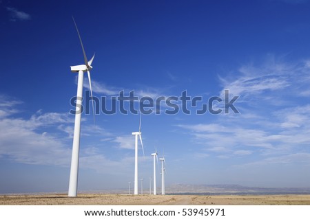 Similar – Foto Bild Windräder am Horizont unter dramatischem Himmel