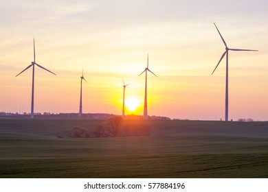 windmills on the field, sunrise - Shutterstock ID 577884196