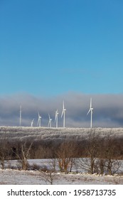 Windmills On A Snow And Ice-covered Elevation In Fulton County, New York State, Near The Adirondacks. USA.