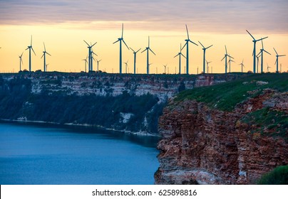 Windmills On The Steep Bank In Norway At The Evening