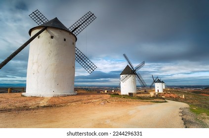 Windmills perched on a hill at Alcazar de San Juan in Ciudad Real, Spain - Shutterstock ID 2244296331