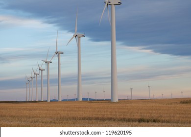 Windmills In The Prairies At Sunrise, Alberta Canada