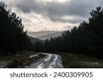 Windmills producing clean electrical energy located on the ridges of Mount Teleno in Castilla y León on a harsh winter day