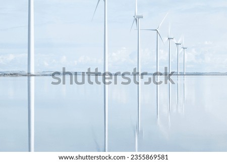Windmills reflecting in danish Fjord. High quality photo