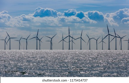 Windmills In The Sea. Wind Power. Green Energy