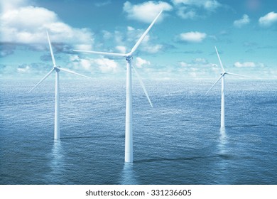 Windmills in the water with cloudy sky 