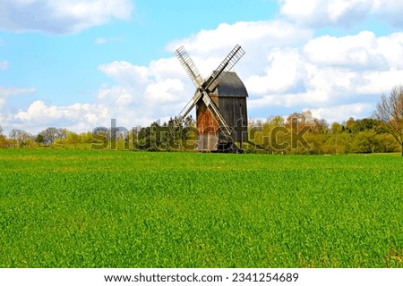 Windmin in polish countryside rural meadow trees traditional rustic landscape