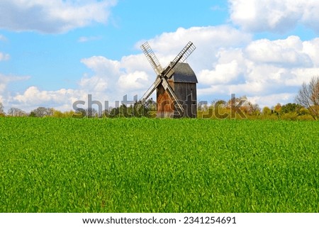 Windmin in polish countryside rural meadow trees traditional rustic landscape