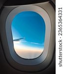 window airplane with sunsest and blue sky