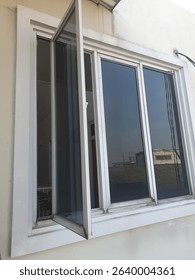 A window is an architectural element that consists of a framed opening in a wall or door, typically fitted with glass or other transparent material. Its primary purpose is to allow natural light and a