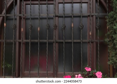window with bars and flowers 
