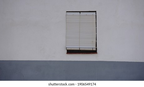 window with blind in facade