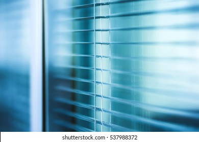 Window Blinds Close Up In The Office Building With Blue Color Tone Effect