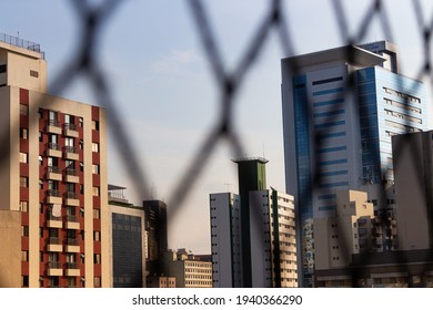 Window with buildings in the background