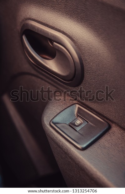 Window button in\
car, technology and\
mechanics