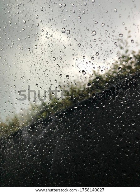 Window of a car in a rainy
day
