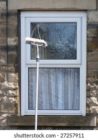 Window Cleaning Brush On Pole Spays Water Onto Glass