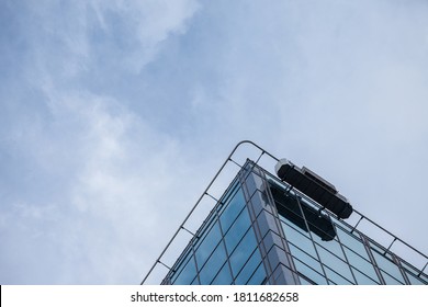 Window Cleaning Platform At The Top Of A High Rise Office Building Skyscrapers Used By Workers To Maintain The External Glasses Of The Tower.

