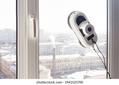 Window Cleaning Robot On Dirty Window, Sunlight