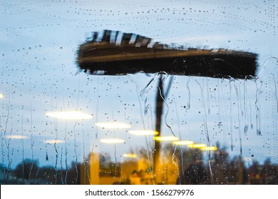 Window Cleaning Using Telescopic Water Brush And Wash System. Commercial Window Cleaning From The Outside With Sky In Background 