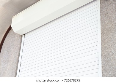 Window with closed roller shutter, closeup