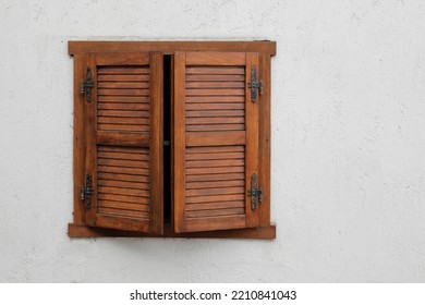 Window With Closed Wooden Shutter,
White Stone House Wall, No Person