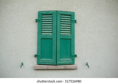 Window With Closed Wooden Shutters