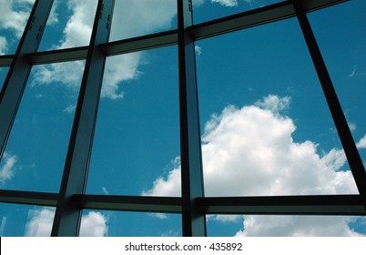 Window to the cloudy blue sky