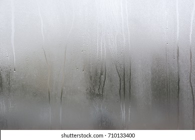 Window with condensate or steam after heavy rain, large texture or background - Shutterstock ID 710133400