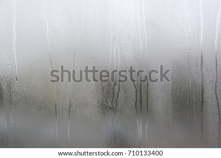 Window with condensate or steam after heavy rain, large texture or background 商業照片 © 