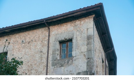 Window in corner of stone building
