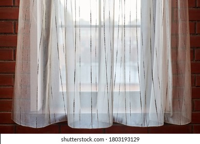Window curtains in loft apartments. Translucent white curtains in modern bedroom, copy space. - Shutterstock ID 1803193129