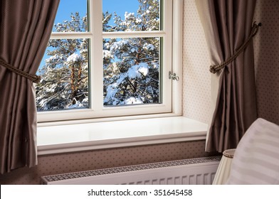 Window With Curtains In Winter